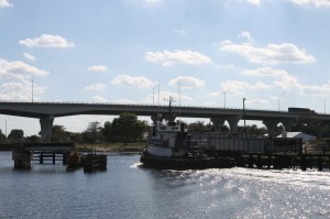 Working boat leaving Moore Haven Lock