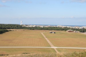 The site of the first flight. The two sheds are the camp.